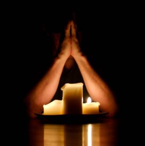 Praying with Candle Light